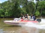 Speeding up the river towards the destroyed rainforest